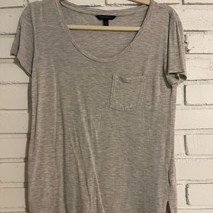 Basic banana republic pocket tee. Does have a small hole on one side on sleeve.
